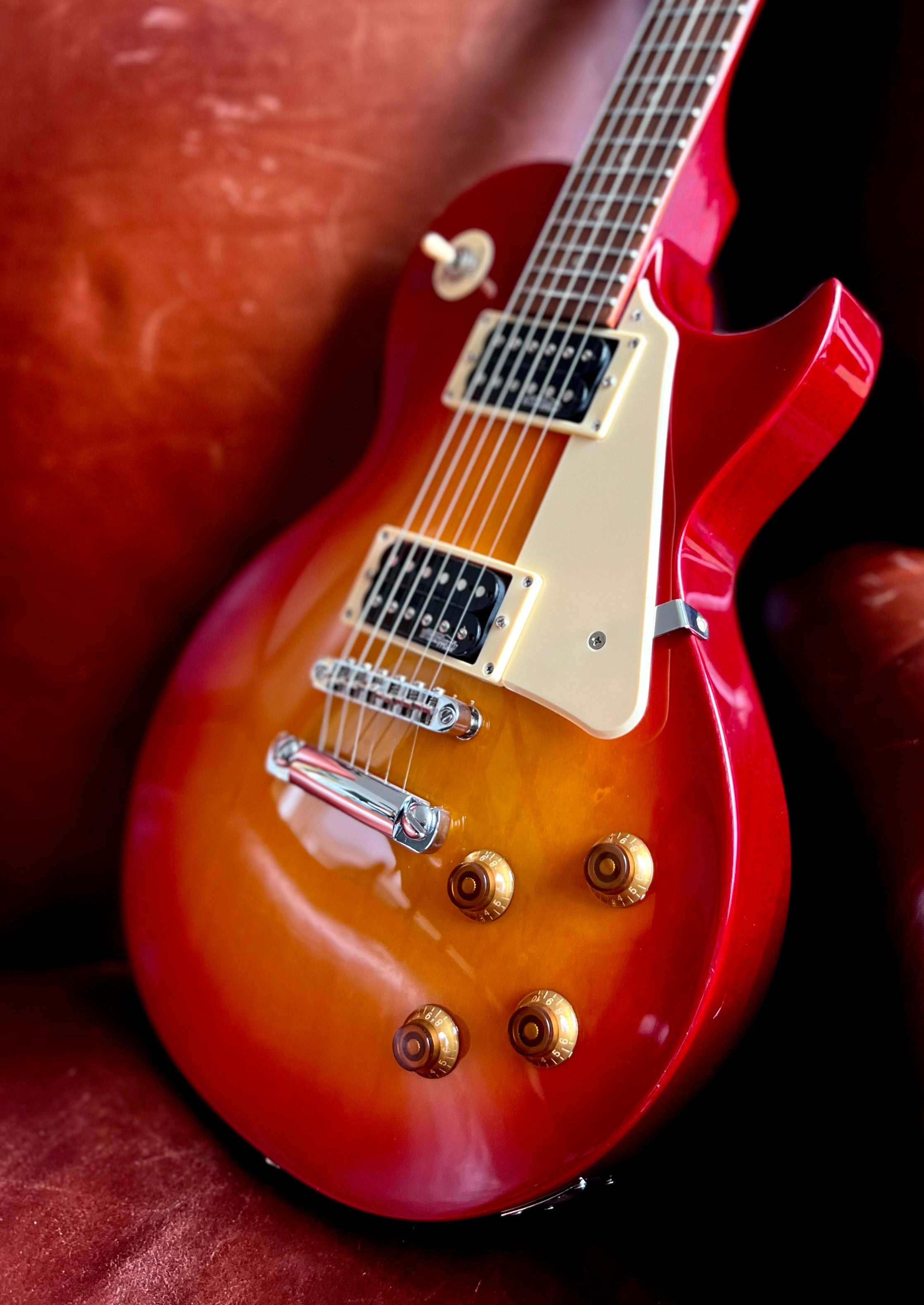 Vintage V100NB ReIssued Electric Guitar ~ Unbound Cherry Sunburst, Electric Guitar for sale at Richards Guitars.