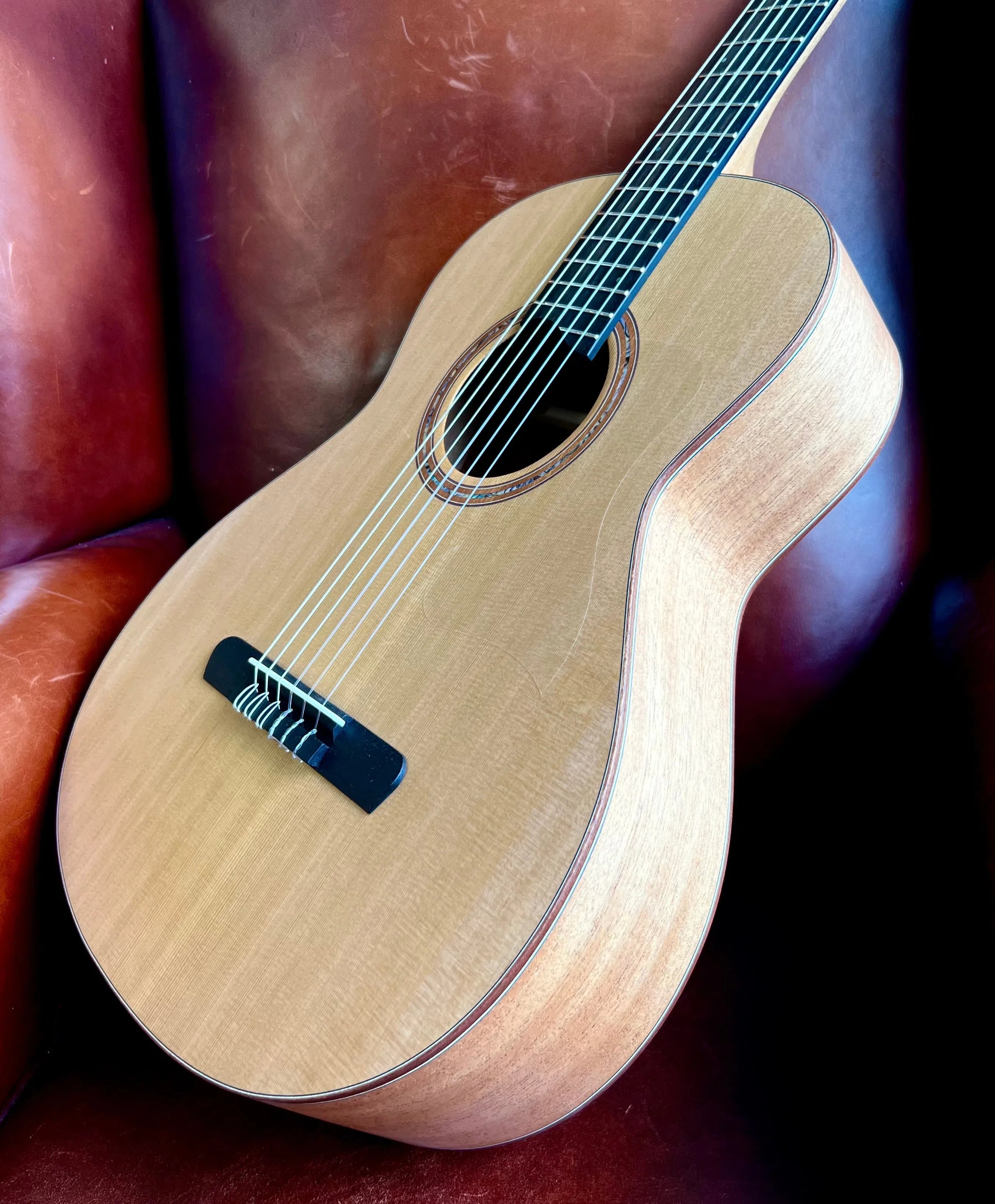 Dowina Mahogany OMG-H Cedar.  OM Body Nylon Hybrid Acoustic Guitar, Nylon Strung Guitar for sale at Richards Guitars.