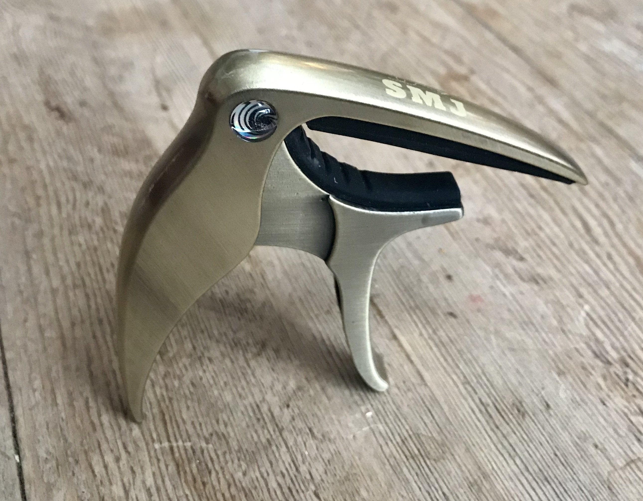 SMJ Guitar Capo (£1 Goes To Butterfly Conservation), Capos for sale at Richards Guitars.