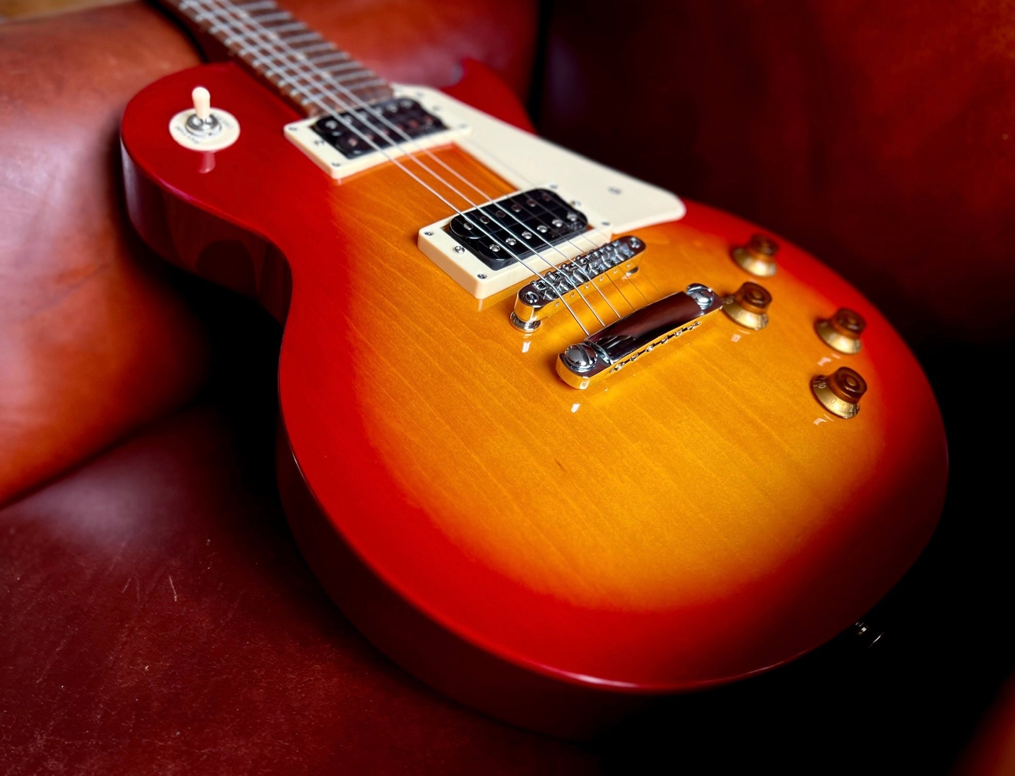 Vintage V100NB ReIssued Electric Guitar ~ Unbound Cherry Sunburst, Electric Guitar for sale at Richards Guitars.