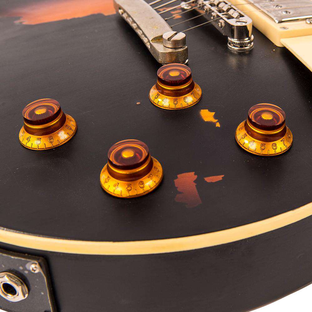 Vintage V100MRBK ICON Electric Guitar ~ Distressed Black Over Sunburst, Guitare électrique en vente chez Richards Guitars.